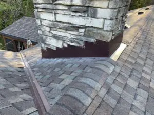 Adonis Roofing team performing roof repairs on a home in Delafield, WI