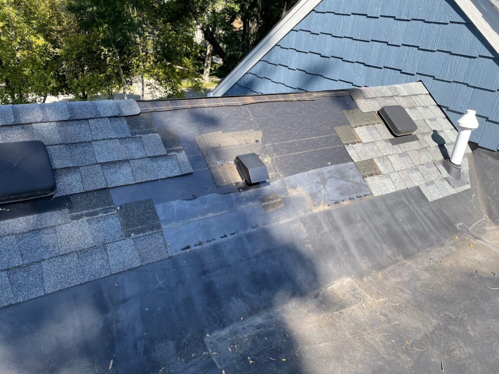 Adonis Roofing team performing roof repairs on a home in Lake Country WI.