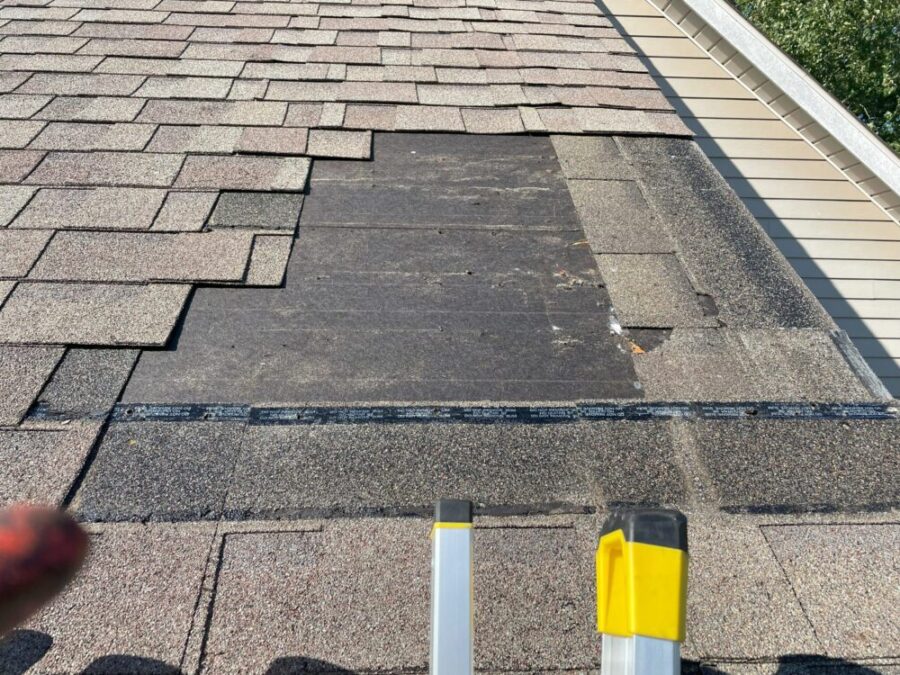 Adonis Roofing team performing roof repairs on a home in Lake Country WI